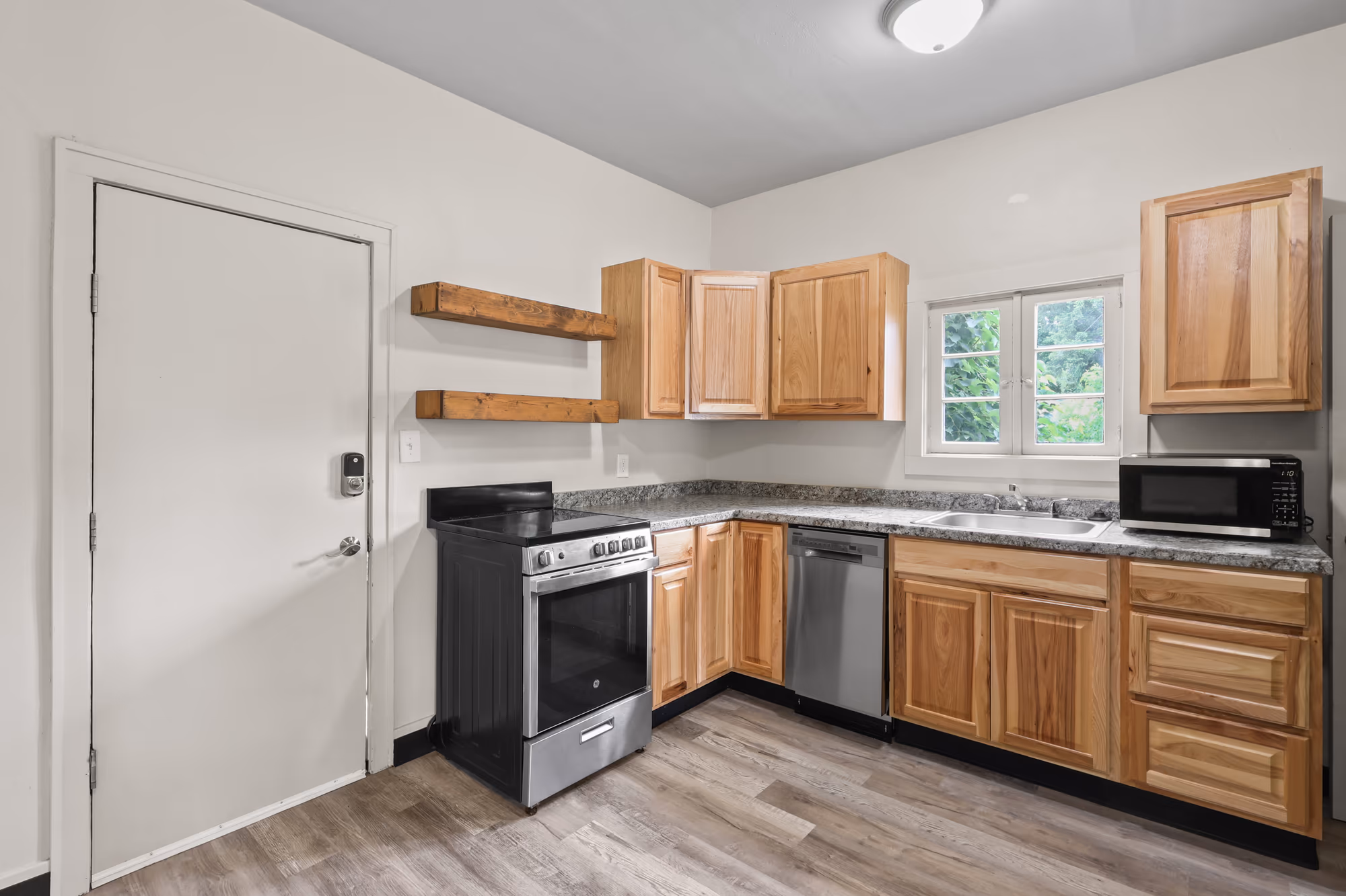 Kitchen with wood cabinetry and a stainless range