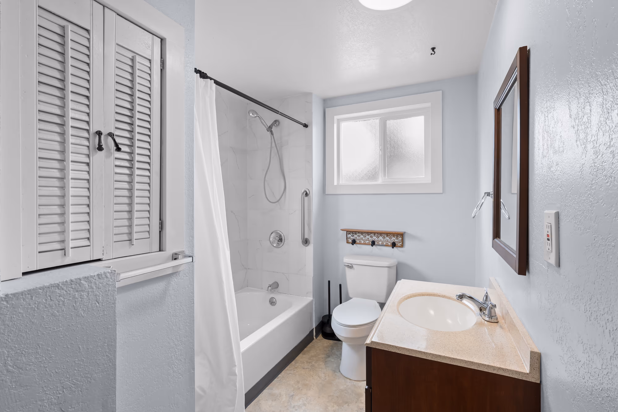 Bathroom with plantation shutters and a soaking tub