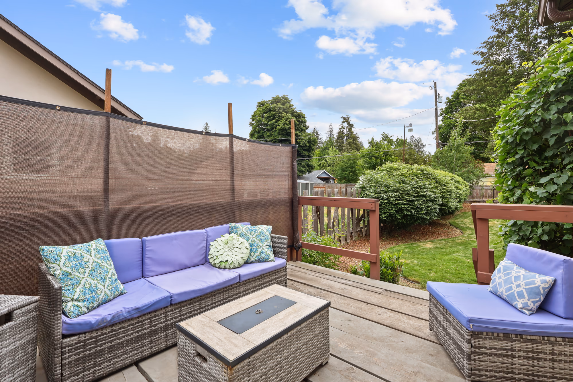 Backyard patio seating area in afternoon light