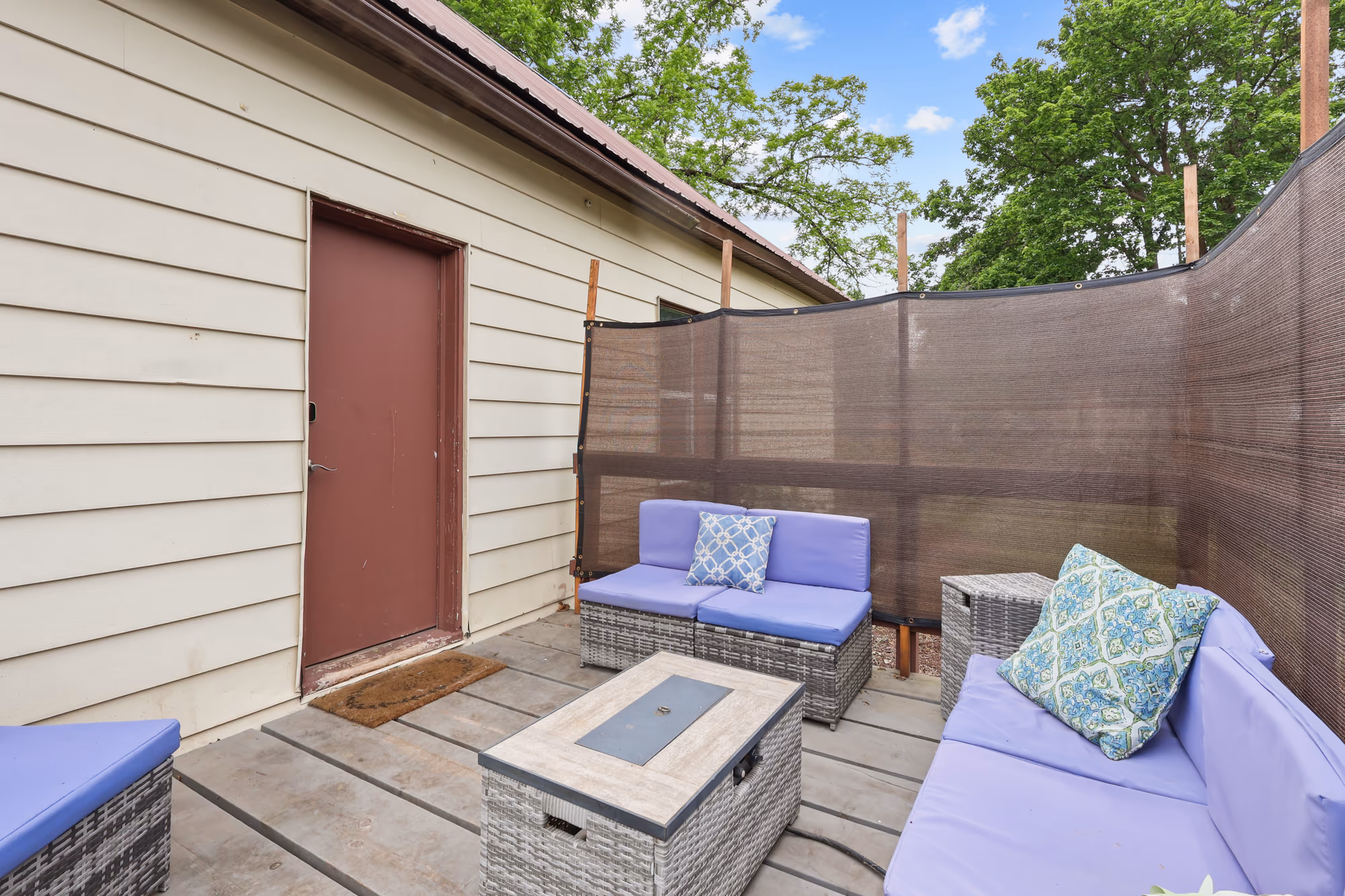 Covered patio lounge with cushioned seating
