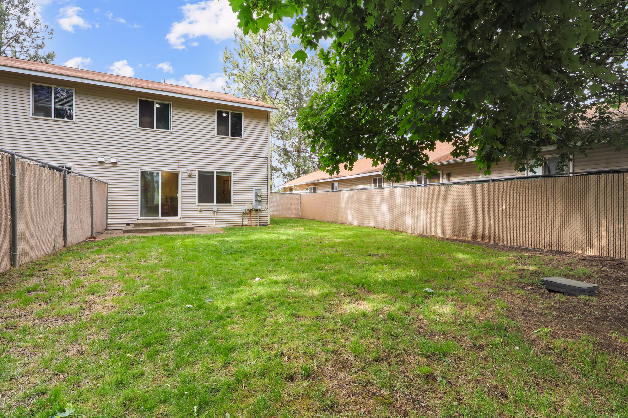 Backyard and rear exterior of a two-story home