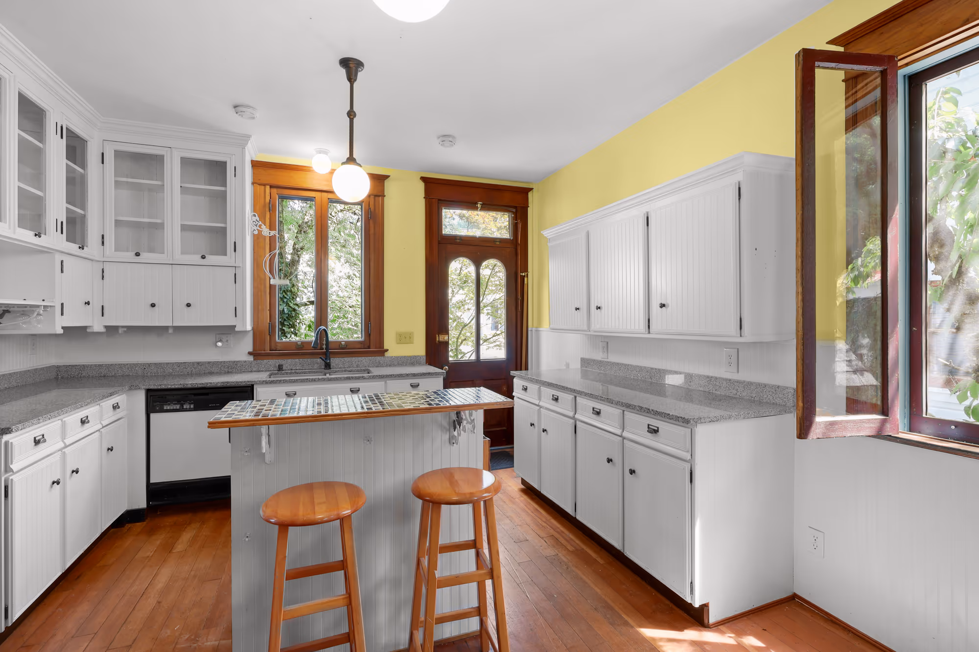 Vintage kitchen with glass-front cabinets and a center island
