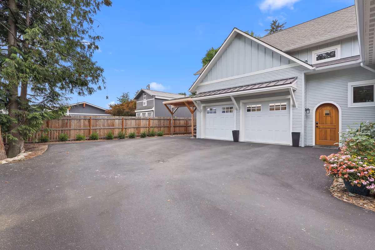 Detached garage beside the cottage driveway